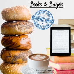 A stack of bagels beside a cappuccino, books, and an eReader.