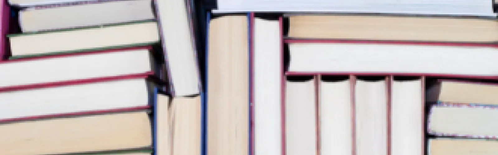 A messy stack of books.